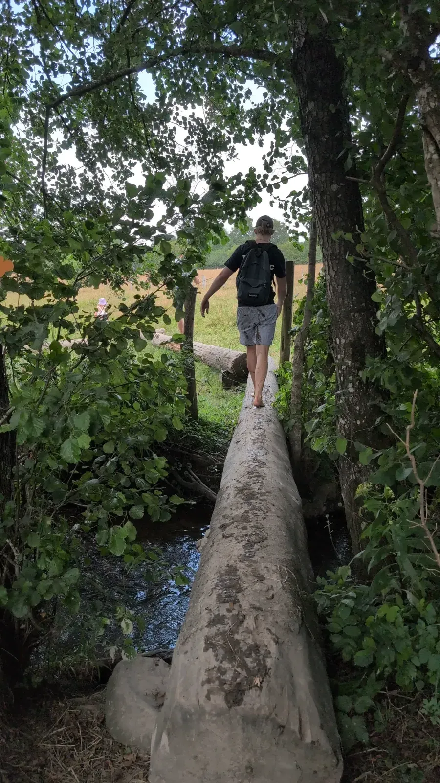 Crossing a small stream on the barefoot trail